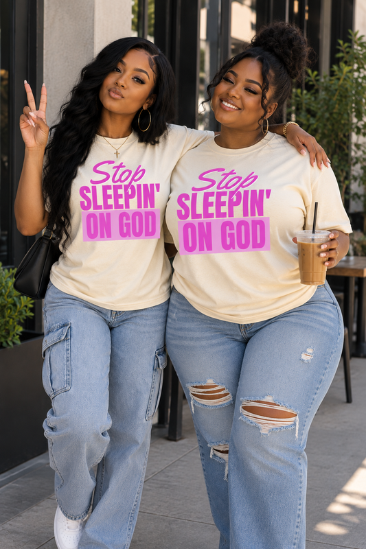 Two models wearing Stop Sleepin’ On God cream and pink tees