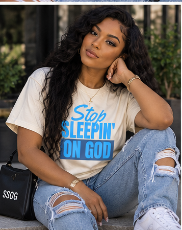 Model wearing Stop Sleepin’ On God cream blue tee