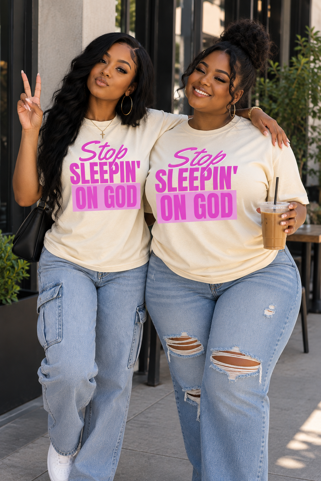 Two models wearing Stop Sleepin’ On God cream and pink tees